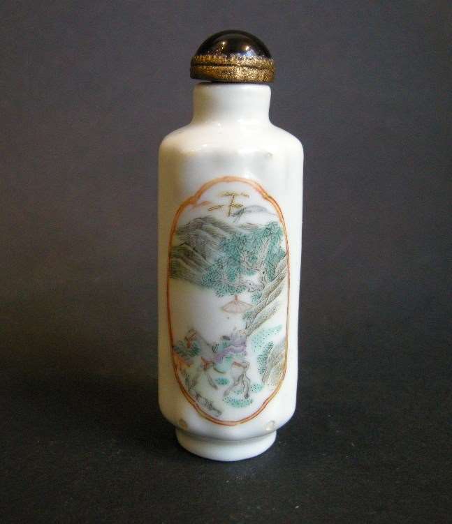 Porcelain snuff bottle with two panels decorated with figures in a landscapes